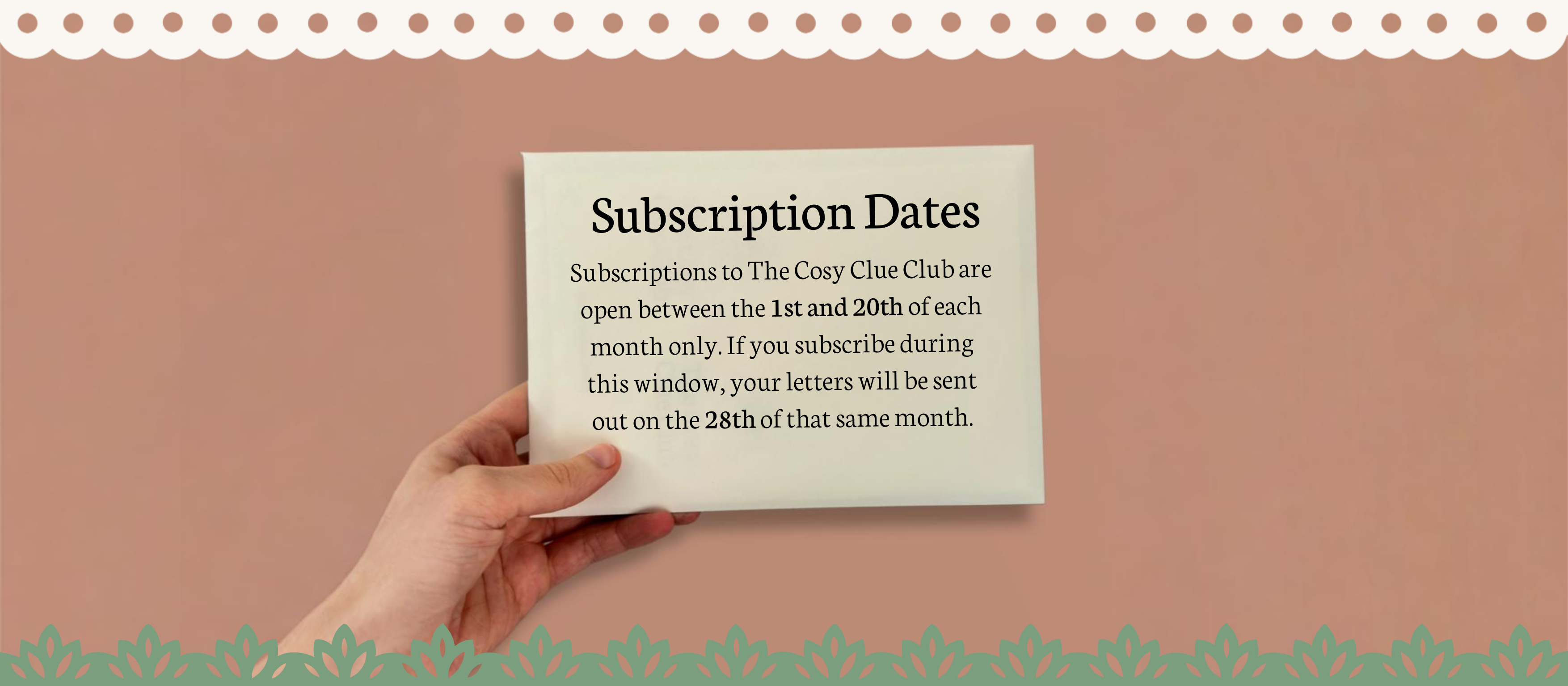 Hand holding a card with subscription dates text against a brown and green background